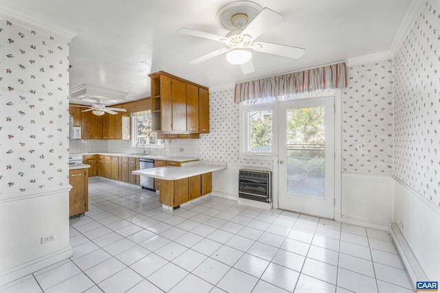 kitchen featuring crown molding, ceiling fan, light tile patterned flooring, stainless steel dishwasher, and kitchen peninsula