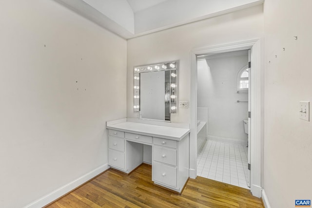 bathroom featuring vanity and hardwood / wood-style floors