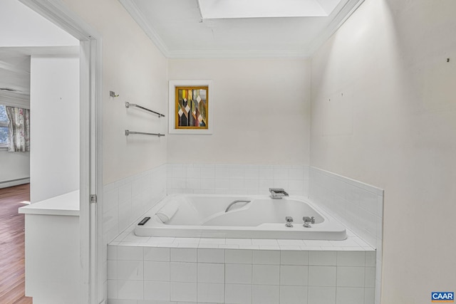 bathroom with crown molding, a baseboard radiator, a relaxing tiled tub, and hardwood / wood-style flooring