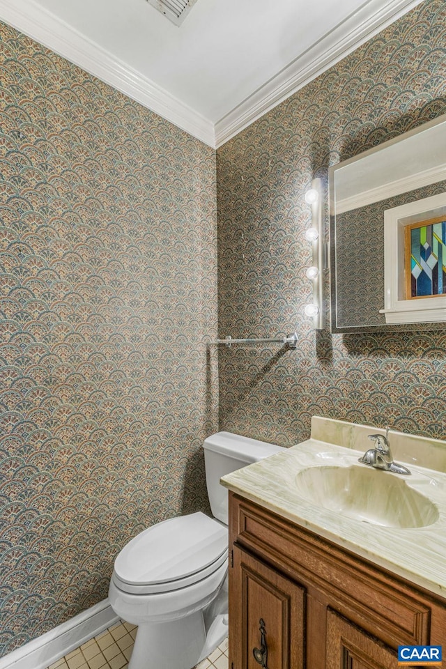 bathroom featuring ornamental molding, vanity, tile patterned floors, and toilet