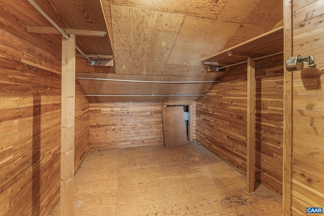 walk in closet with lofted ceiling