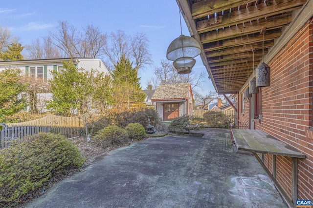 view of patio / terrace with an outbuilding