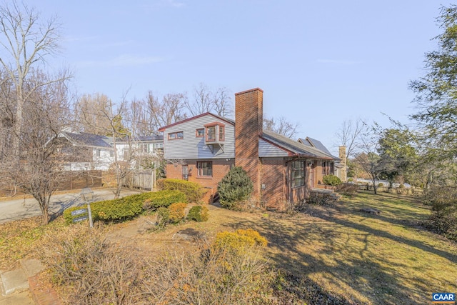 view of property exterior featuring a yard