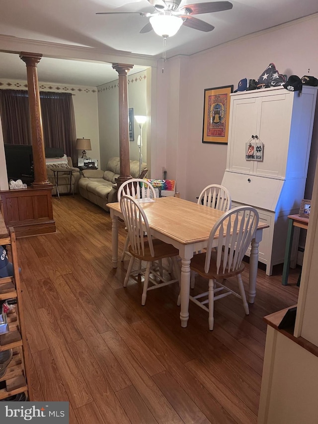 dining space with ornate columns, hardwood / wood-style floors, and ceiling fan