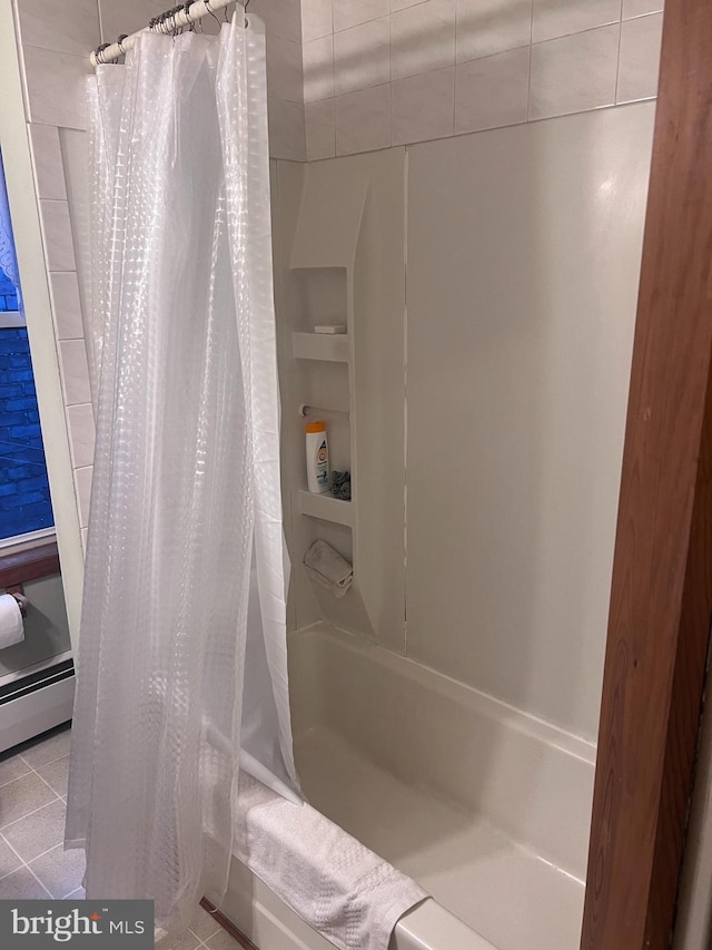 bathroom featuring built in shelves, tile patterned floors, shower / bath combo with shower curtain, and a baseboard heating unit