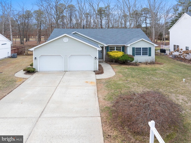 ranch-style house featuring cooling unit, a garage, and a front lawn