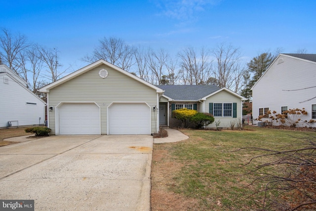 view of front facade with a garage and a front lawn