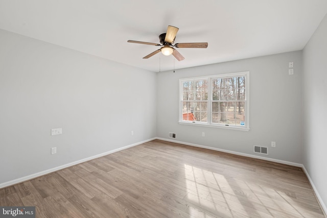 unfurnished room featuring ceiling fan and light hardwood / wood-style flooring