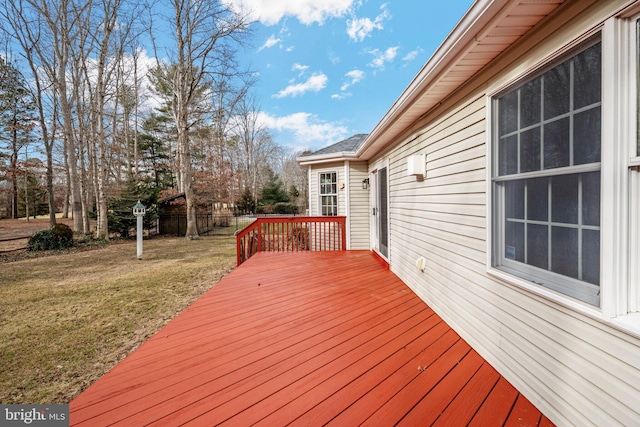 wooden deck with a lawn