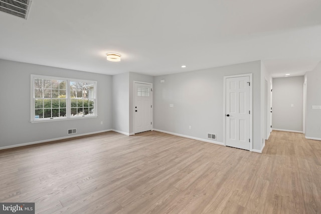 spare room with light wood-type flooring