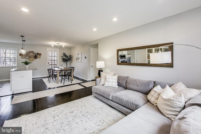 living room featuring plenty of natural light and wood-type flooring