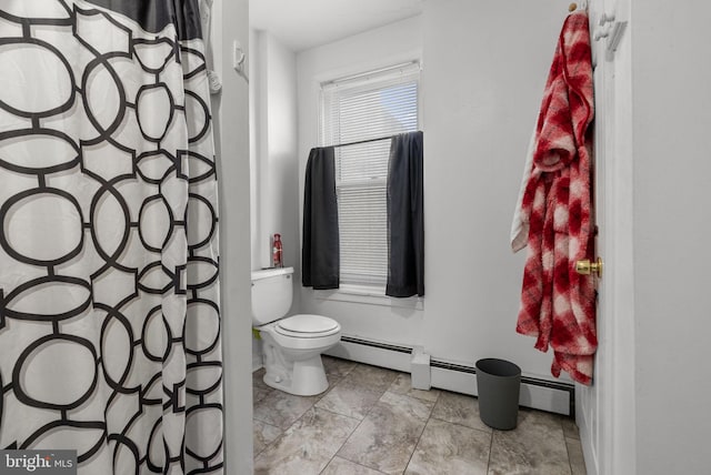 bathroom with toilet and baseboard heating