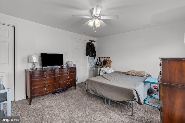 bedroom featuring light colored carpet and ceiling fan