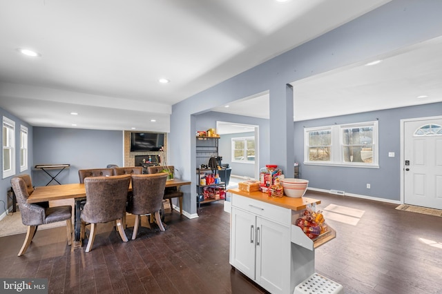 dining space featuring dark wood-type flooring