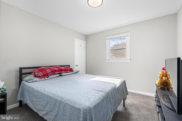 bedroom featuring dark carpet