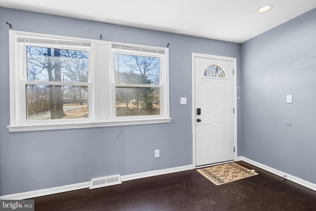 foyer entrance with dark hardwood / wood-style flooring