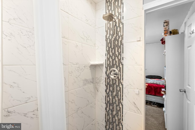 bathroom with tiled shower