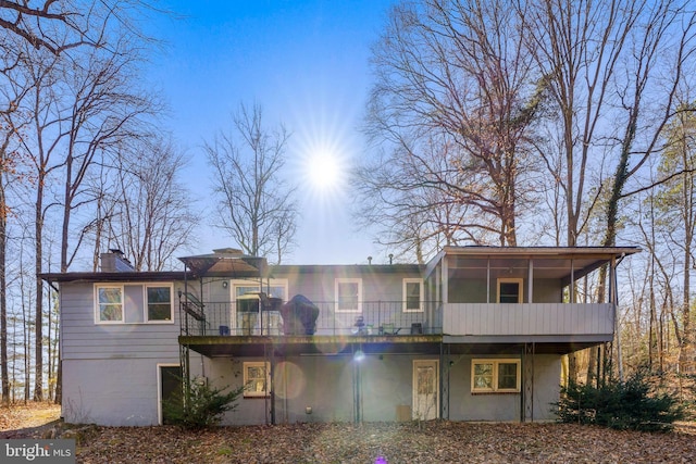 rear view of house with a sunroom