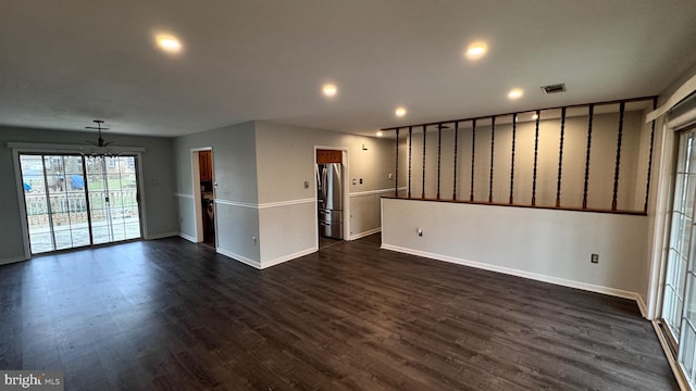 unfurnished living room featuring dark hardwood / wood-style floors