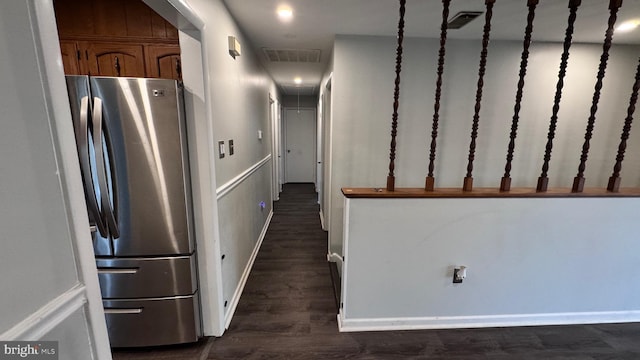 kitchen featuring stainless steel refrigerator and dark wood-type flooring