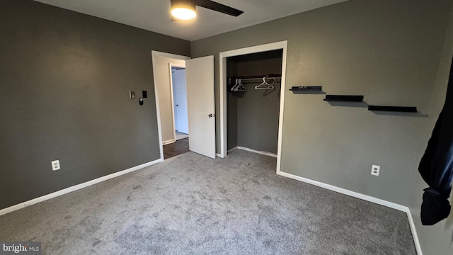 unfurnished bedroom with ceiling fan, carpet floors, and a closet