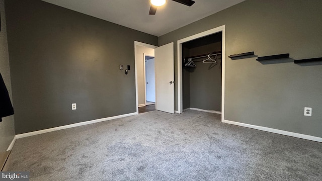 unfurnished bedroom featuring carpet, ceiling fan, and a closet