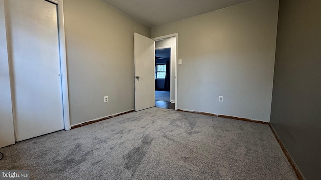 unfurnished bedroom with light carpet