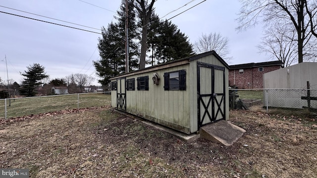 view of outdoor structure with a lawn