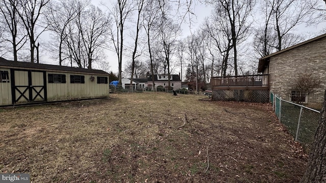 view of yard featuring a shed and a deck