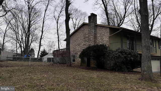 view of side of home with a garage