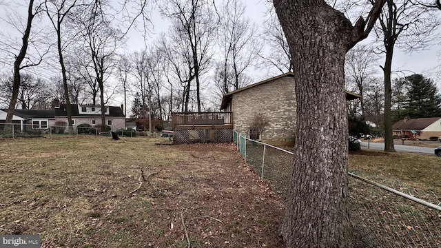 view of yard featuring a wooden deck