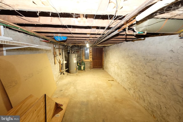 unfinished basement featuring gas water heater and electric panel