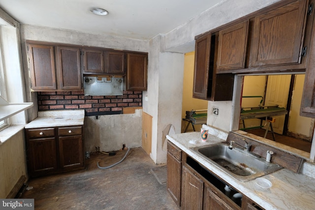 kitchen featuring light countertops and a sink