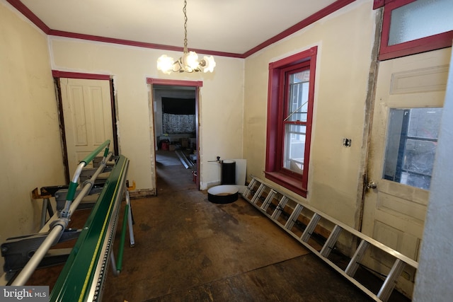 interior space featuring a chandelier and crown molding