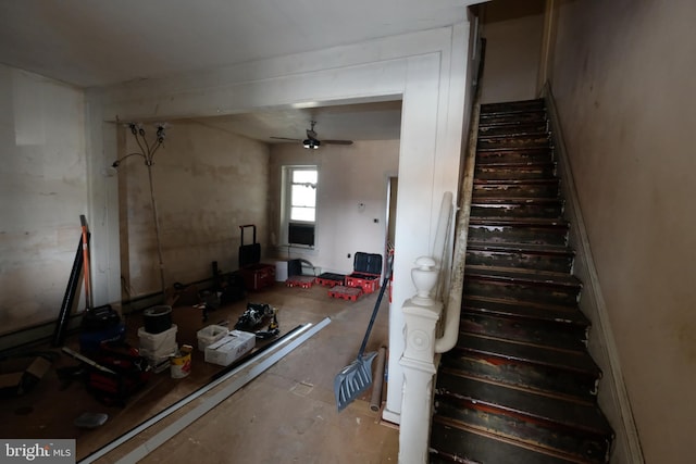 stairway with a ceiling fan