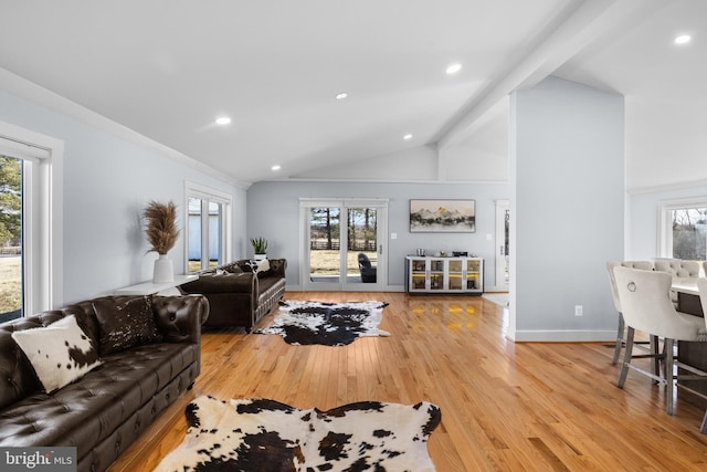 living room with beam ceiling, high vaulted ceiling, and light wood-type flooring