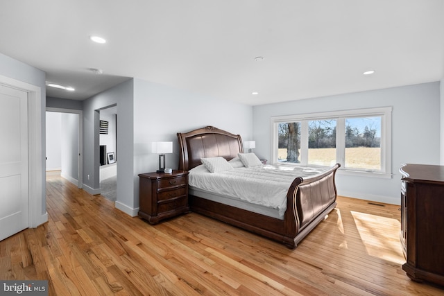 bedroom with light hardwood / wood-style flooring