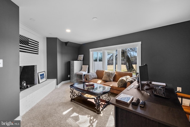 living room with a fireplace and light carpet