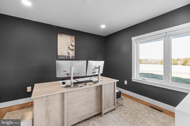 home office featuring light hardwood / wood-style floors