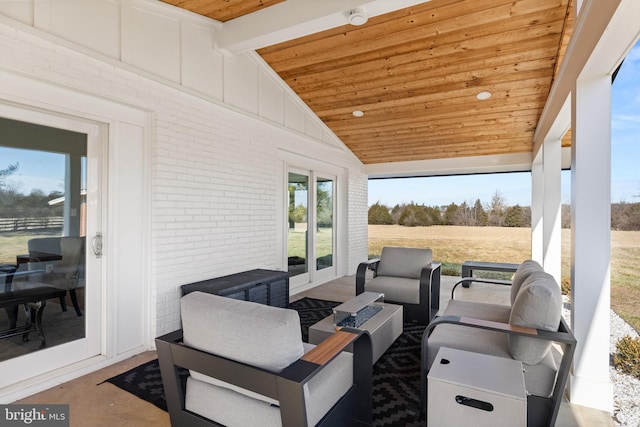 view of patio / terrace with an outdoor living space with a fire pit