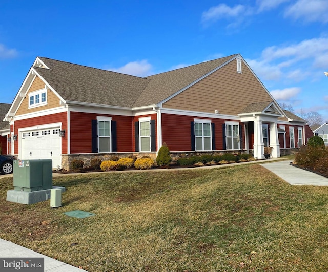 view of front of house featuring a garage and a front yard