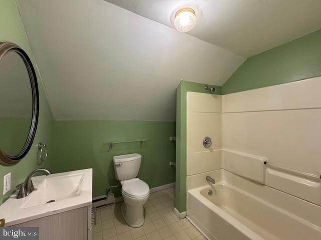 full bathroom with a baseboard radiator, vanity, vaulted ceiling, bathtub / shower combination, and toilet