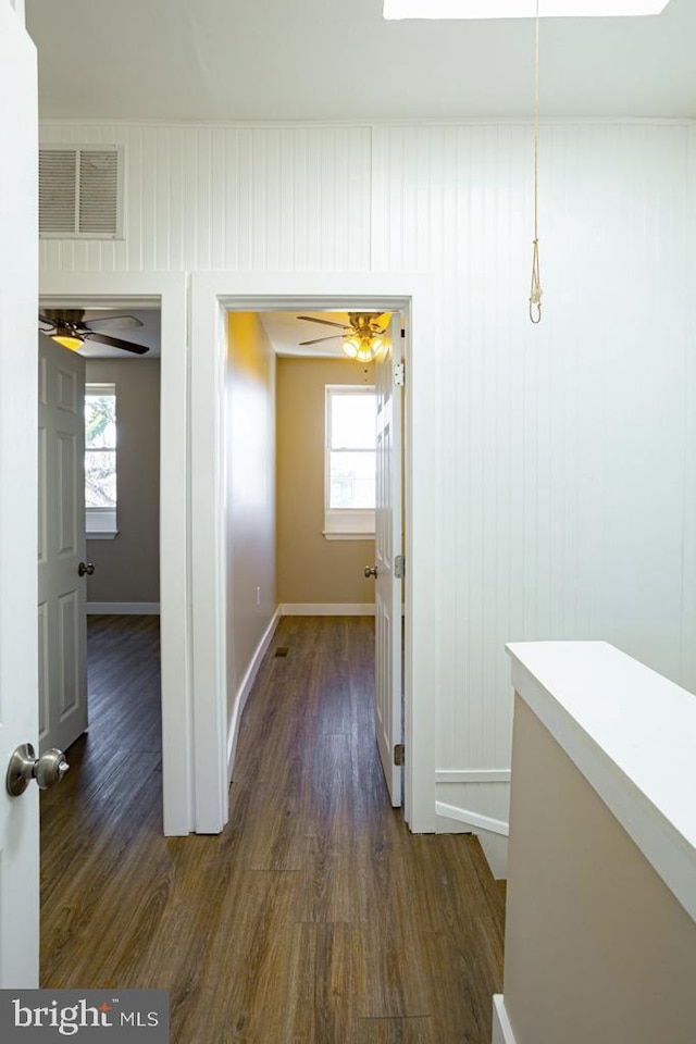 hallway featuring dark hardwood / wood-style flooring