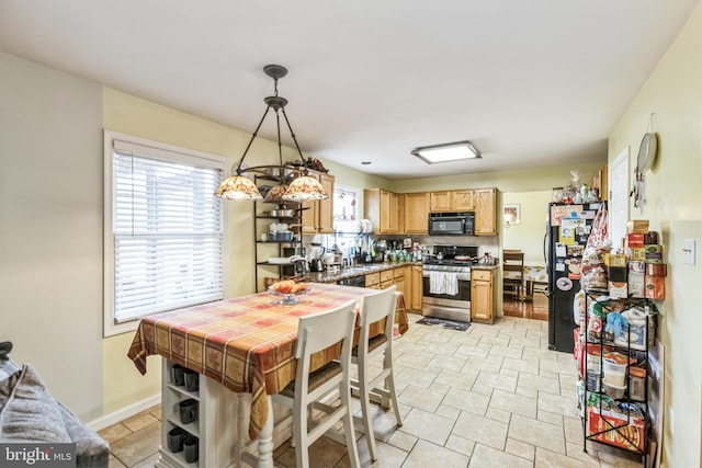 kitchen featuring pendant lighting and black appliances