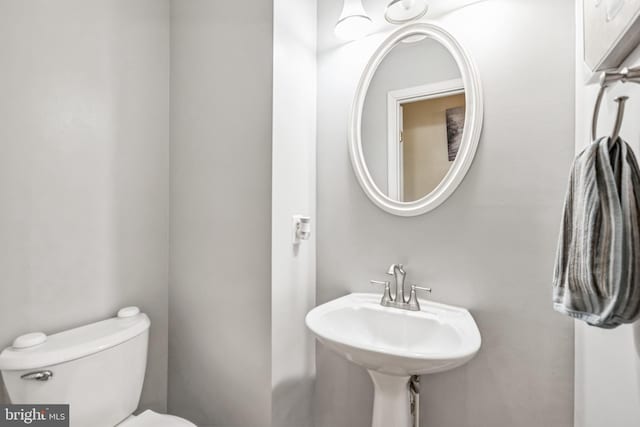 bathroom with sink and toilet