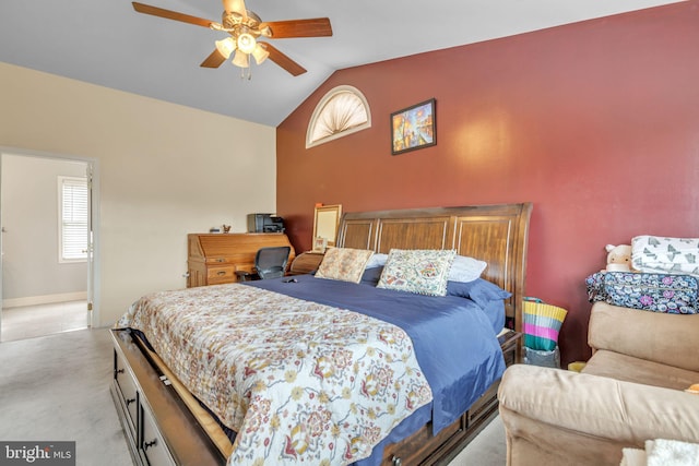 carpeted bedroom featuring ceiling fan and vaulted ceiling