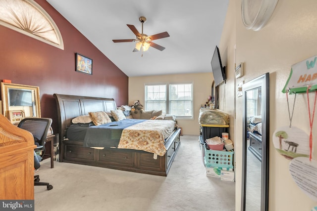 carpeted bedroom featuring lofted ceiling and ceiling fan