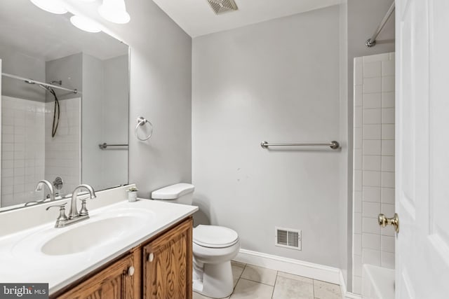 bathroom with vanity, tile patterned floors, and toilet