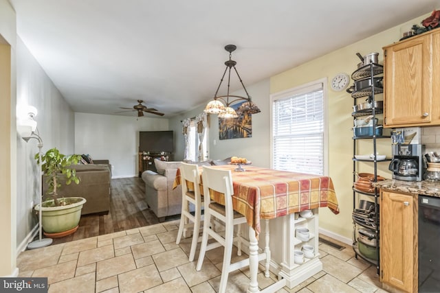 dining space featuring ceiling fan