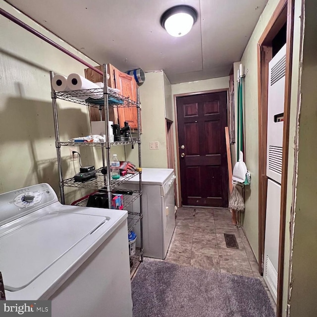 clothes washing area with independent washer and dryer